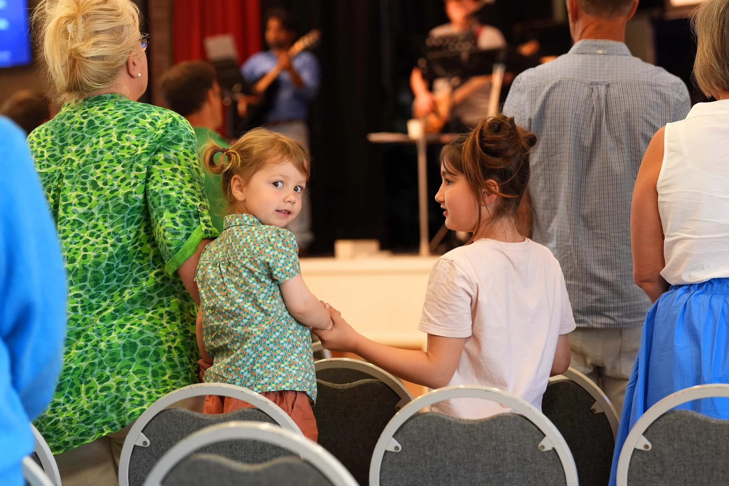  Two young girls sing during a Sunday Service at Grace Community Church, Bedford.