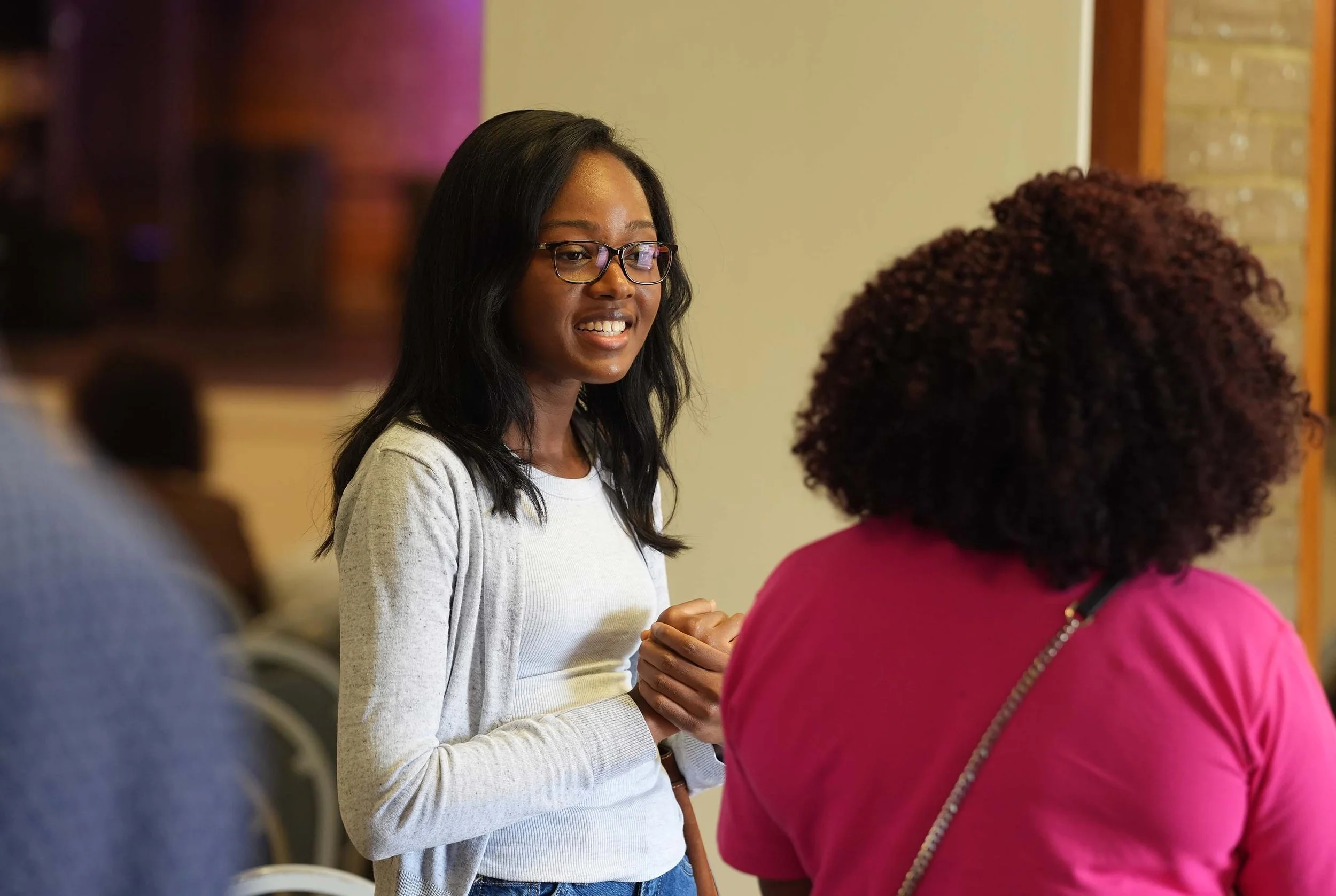 A woman talks with a friend after a Sunday Service at Grace Community Church, Bedford.