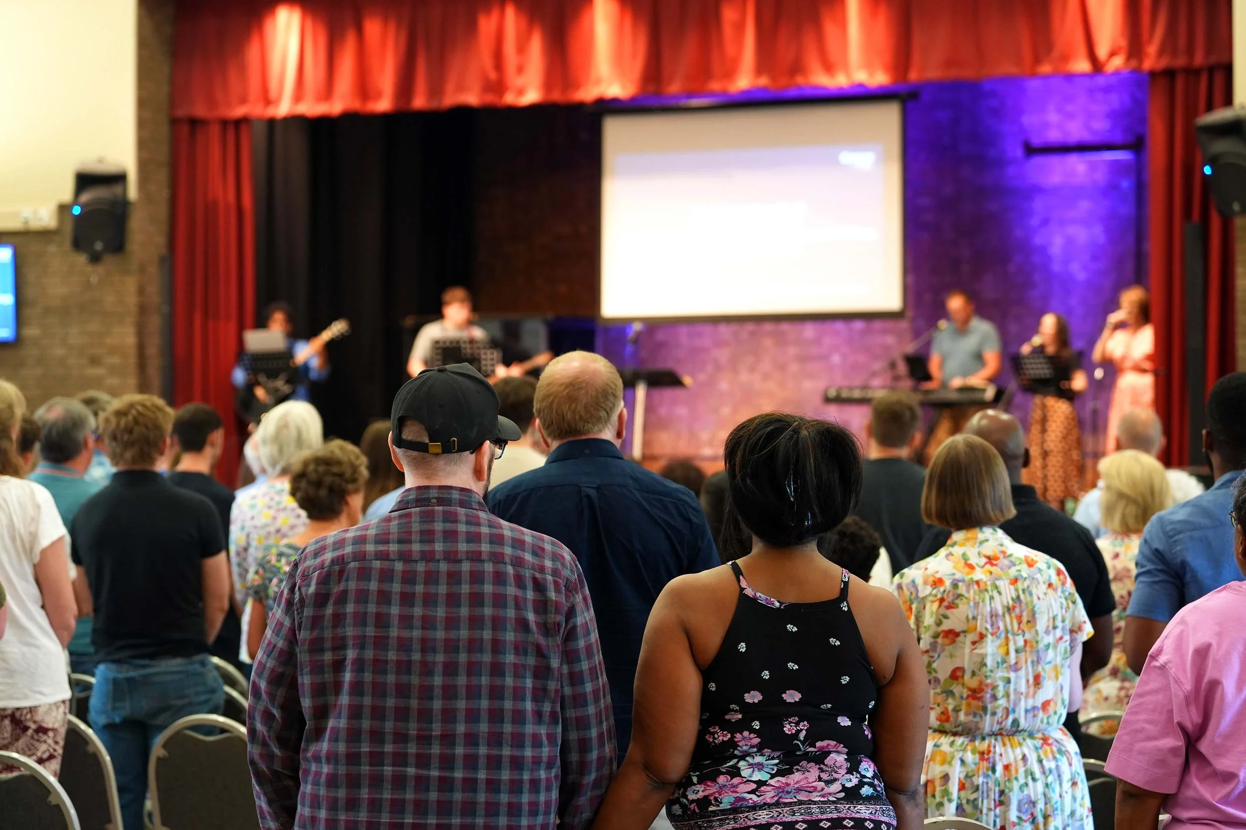 Mid service at a Grace Sunday Service - a diverse congregation sing and worship together as the band lead. #Grace #SundayService #church