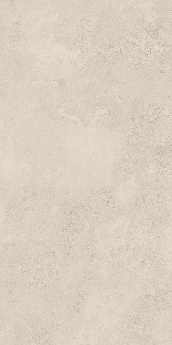 Superficie di pietra o cemento beige chiaro con texture leggermente irregolare.