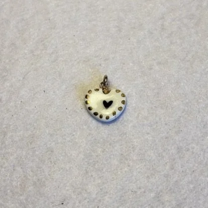 White Porcelain Heart Charm with Center Black Heart and Gold Dotted Border