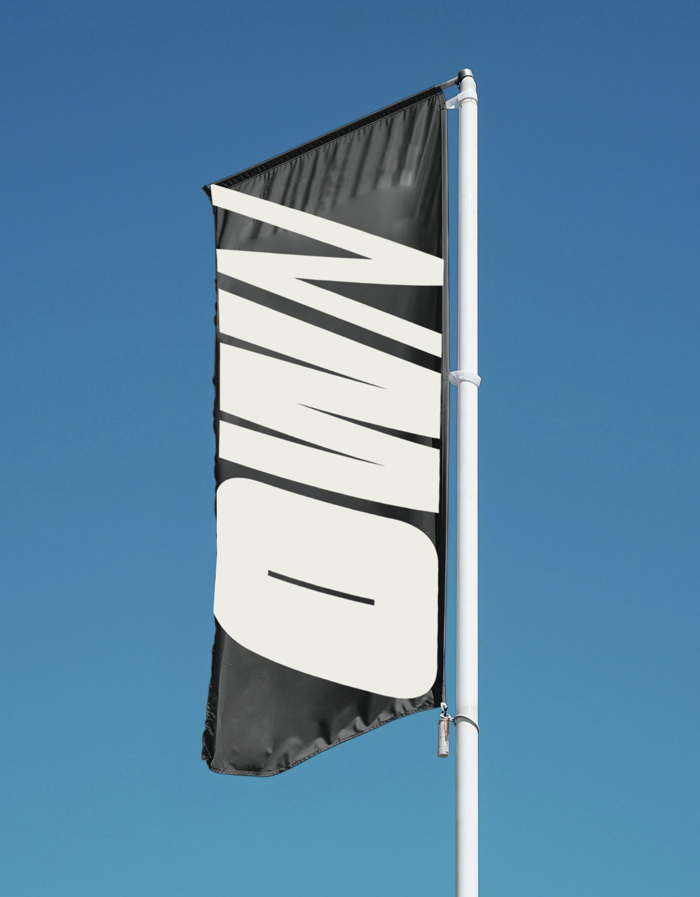 A black and white vertical banner with the word "WIN" printed on it, attached to a white flagpole against a clear blue sky.
