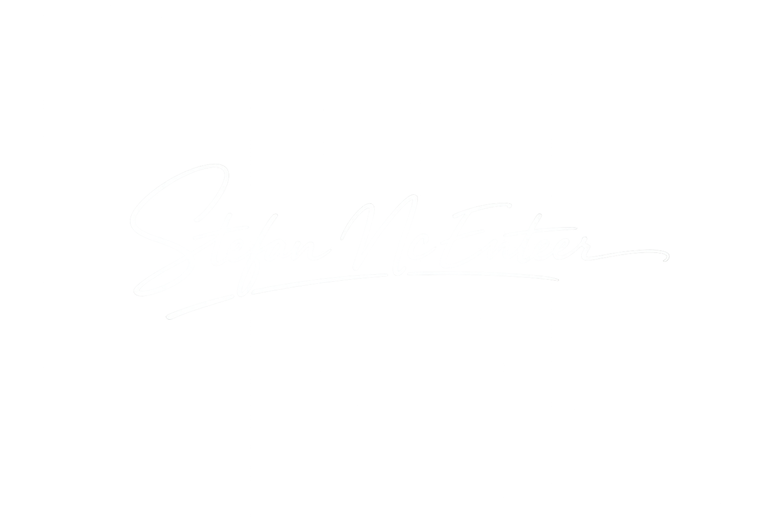 Neon sign displaying the name 'Stefan McEnteer' in cursive white lettering on a black background.