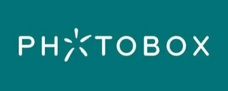 Photobax logo with the text 'photobax' and a green star between 'photo' and 'bax'.