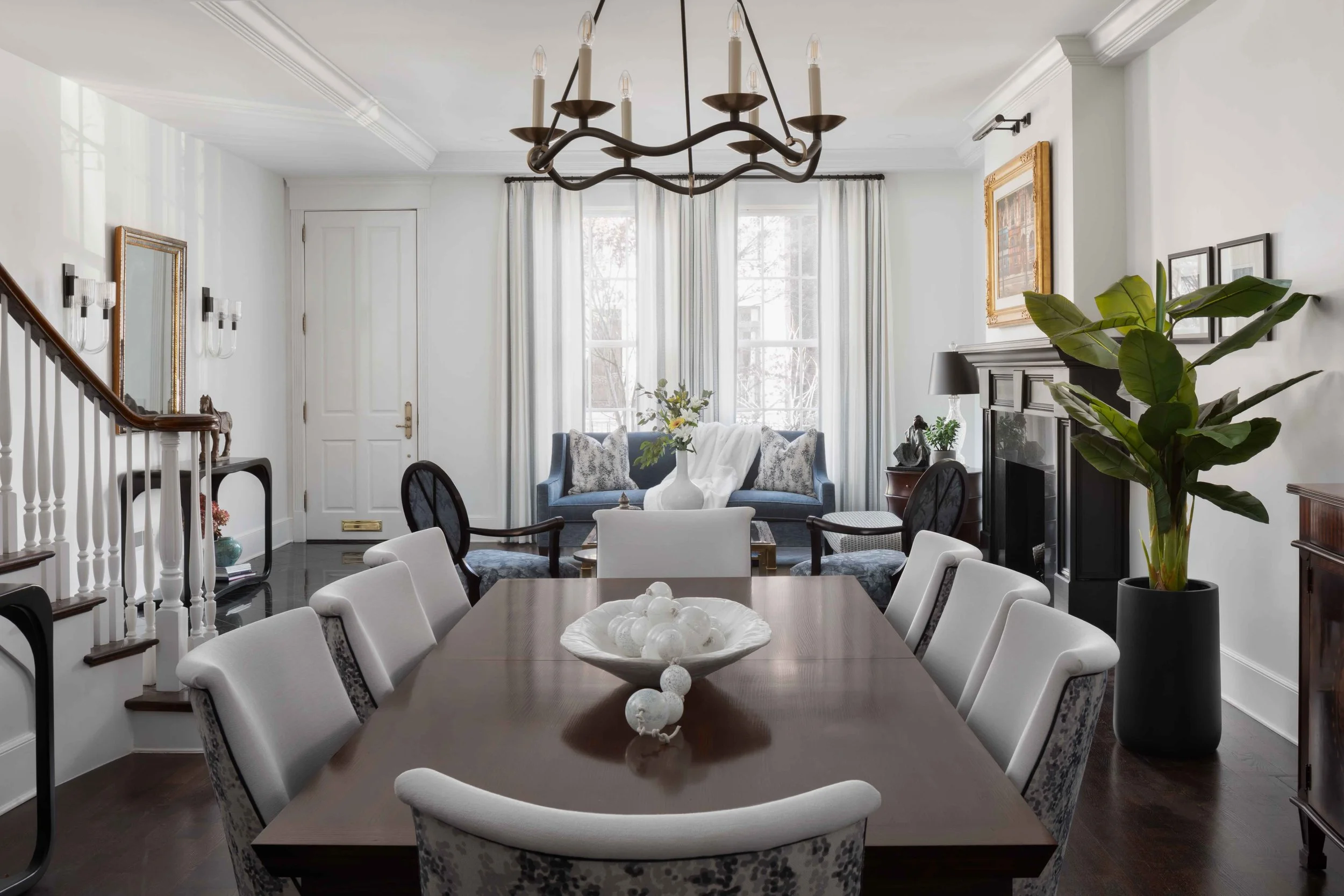 A well-lit dining room by Matte & Gloss Interiors - a full-service residential interior design studio serving Chicago and the North Shore with timeless, refined home design.