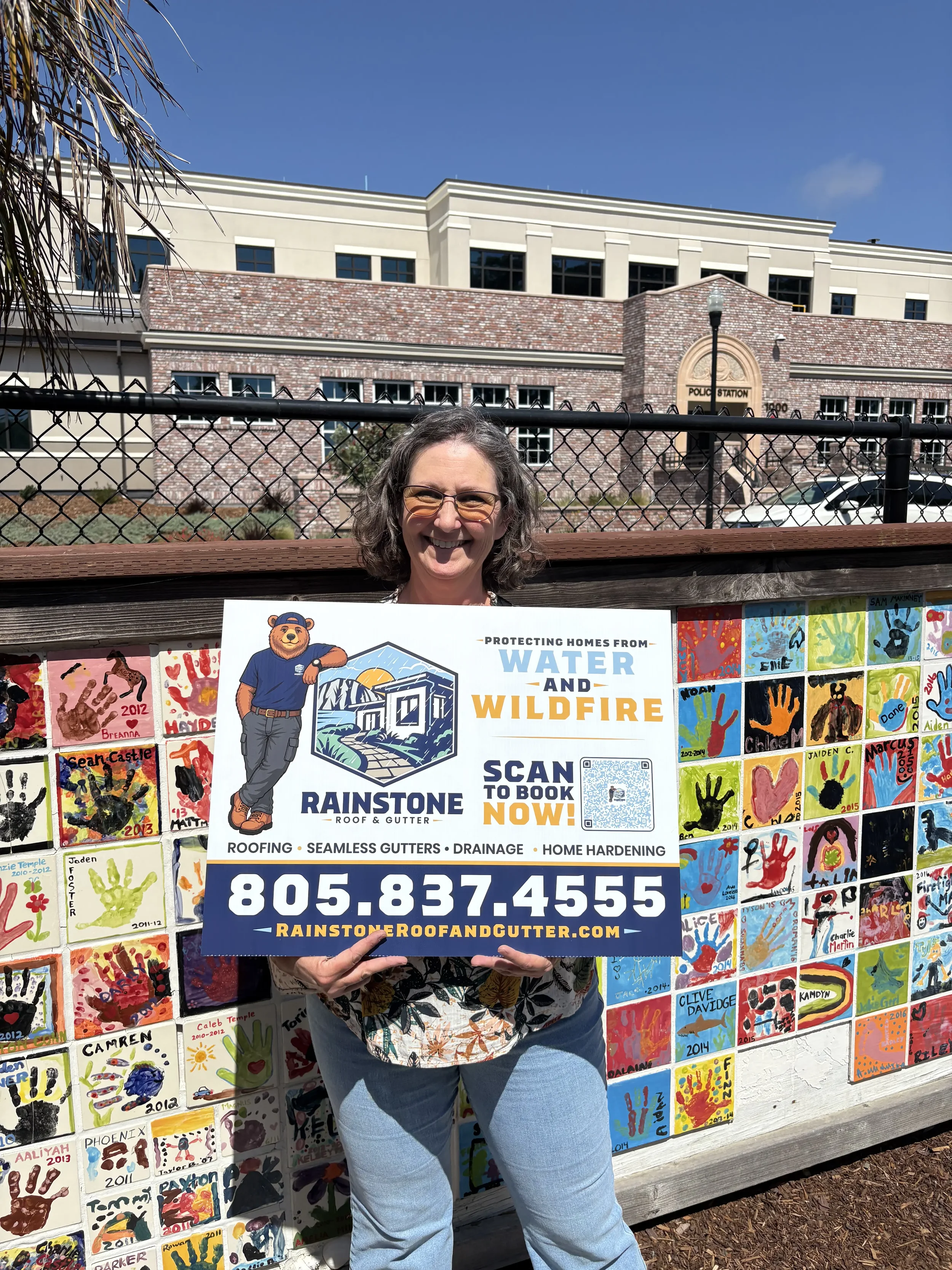 Happy Rainstone customer following a roofing, gutter, or home hardening project on the Central Coast.