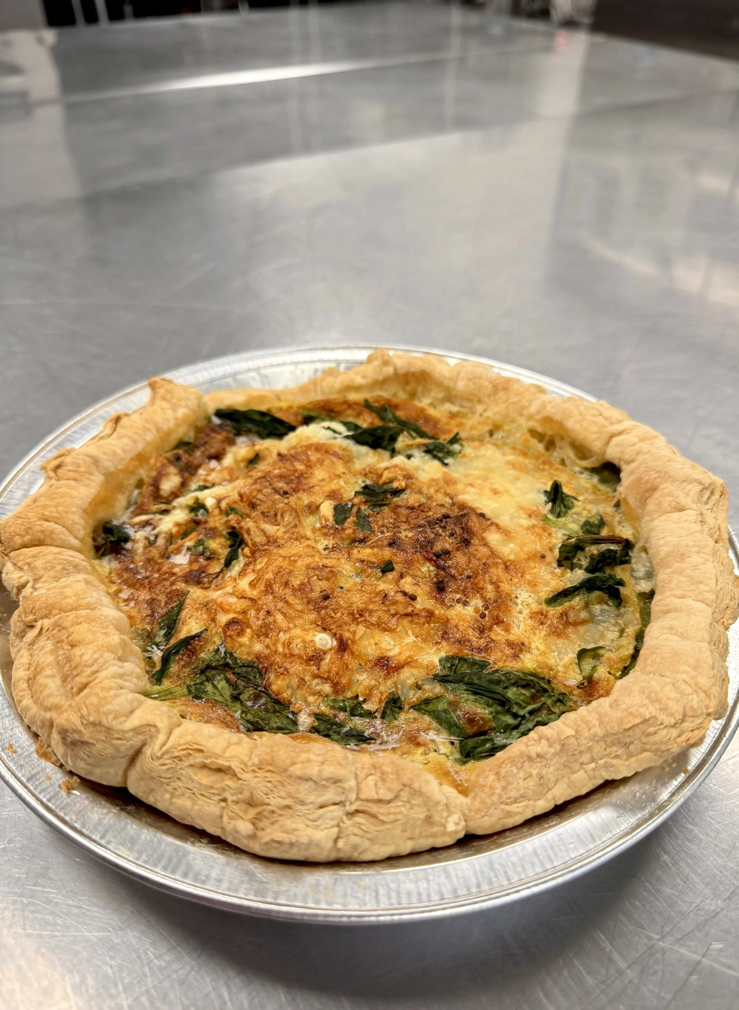 Ham, Swiss & Spinach Quiche served with a Fruit Salad