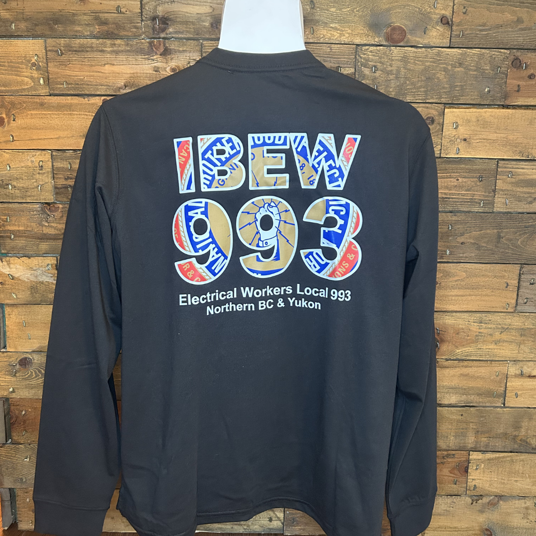 Black jacket with a colorful logo dedicated to electrical workers, reading 'I BEV 993 Electrical Workers Local 993 Northern BC & Yukon', hung against a wooden wall.