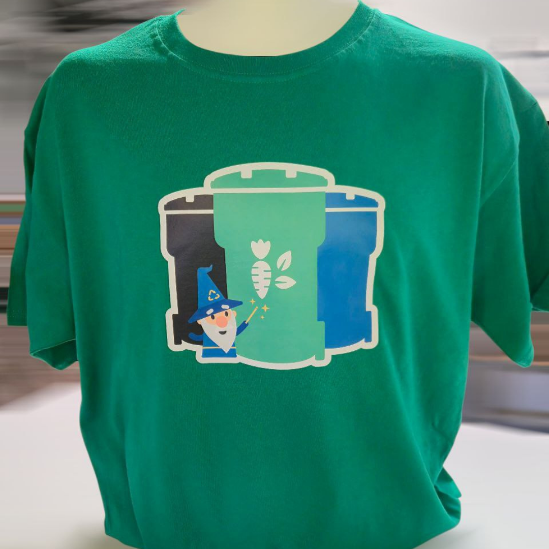 Green t-shirt with a graphic of three compost bins, and a cartoon wizard holding a wand.