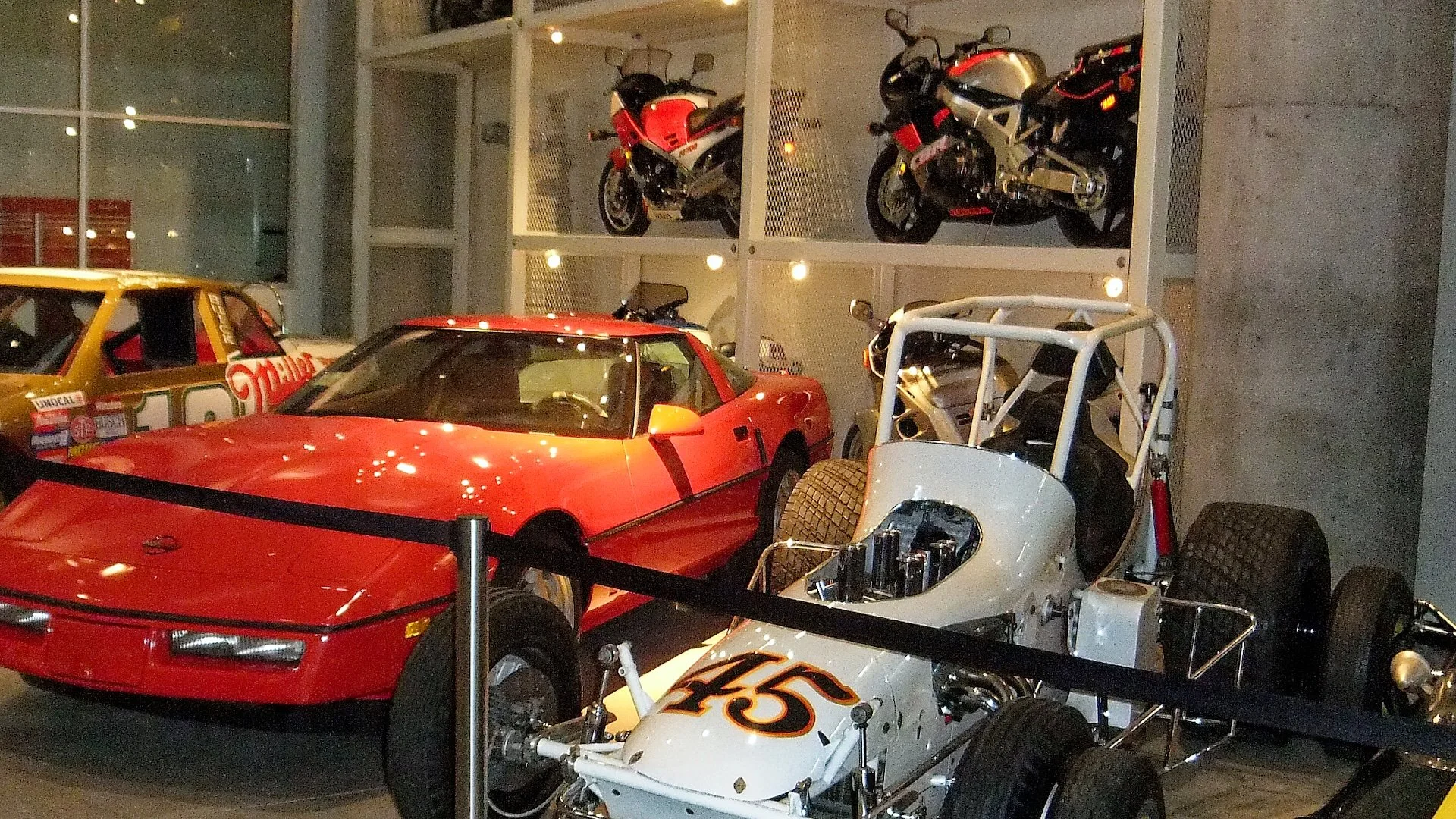 The ground floor contains various road and race cars, along with the restoration shop.