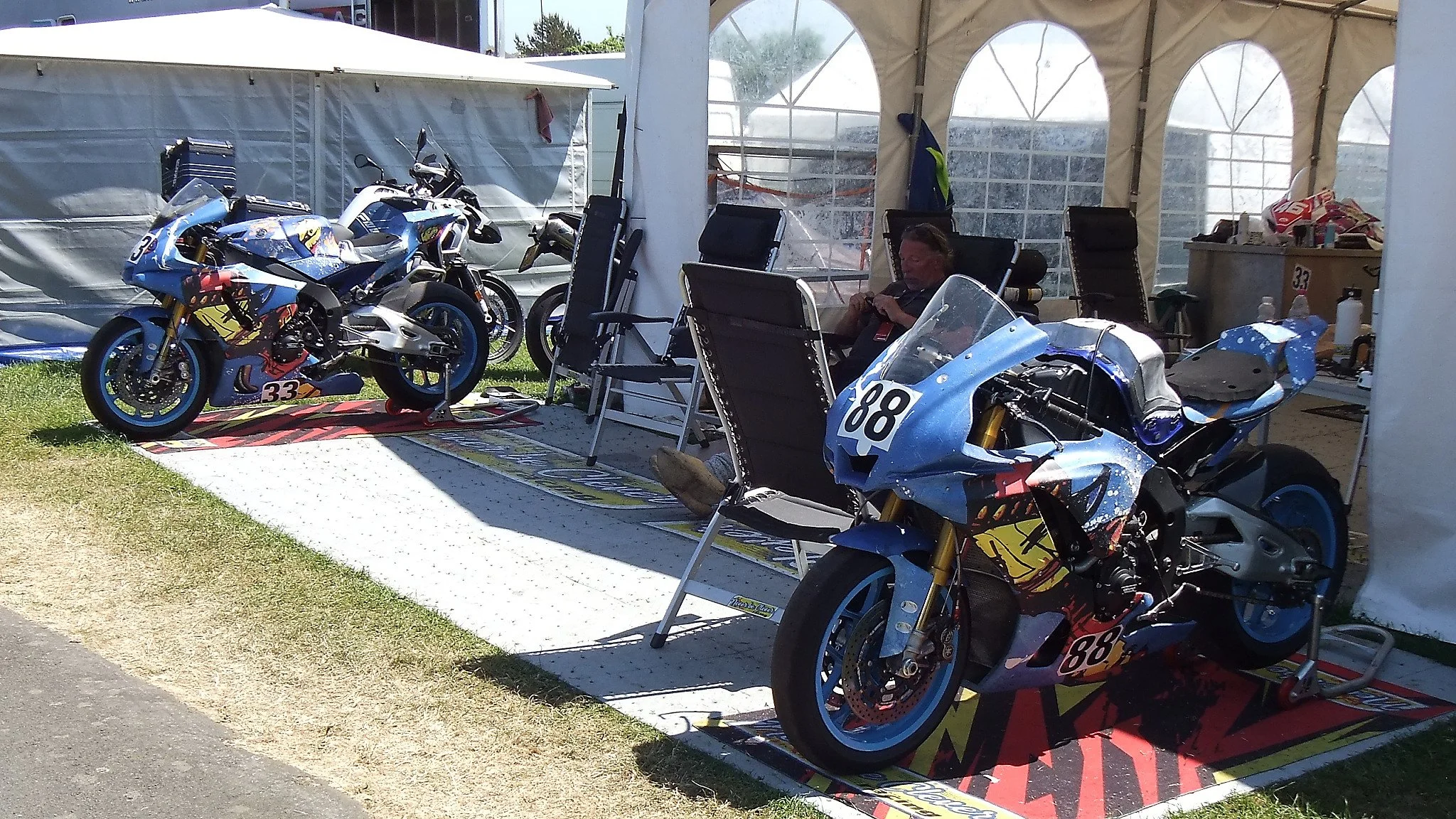 Teams come from all over to compete at the Isle of Man TT.  The #33 and #88 bikes of Never be Clever Racing come from France.
