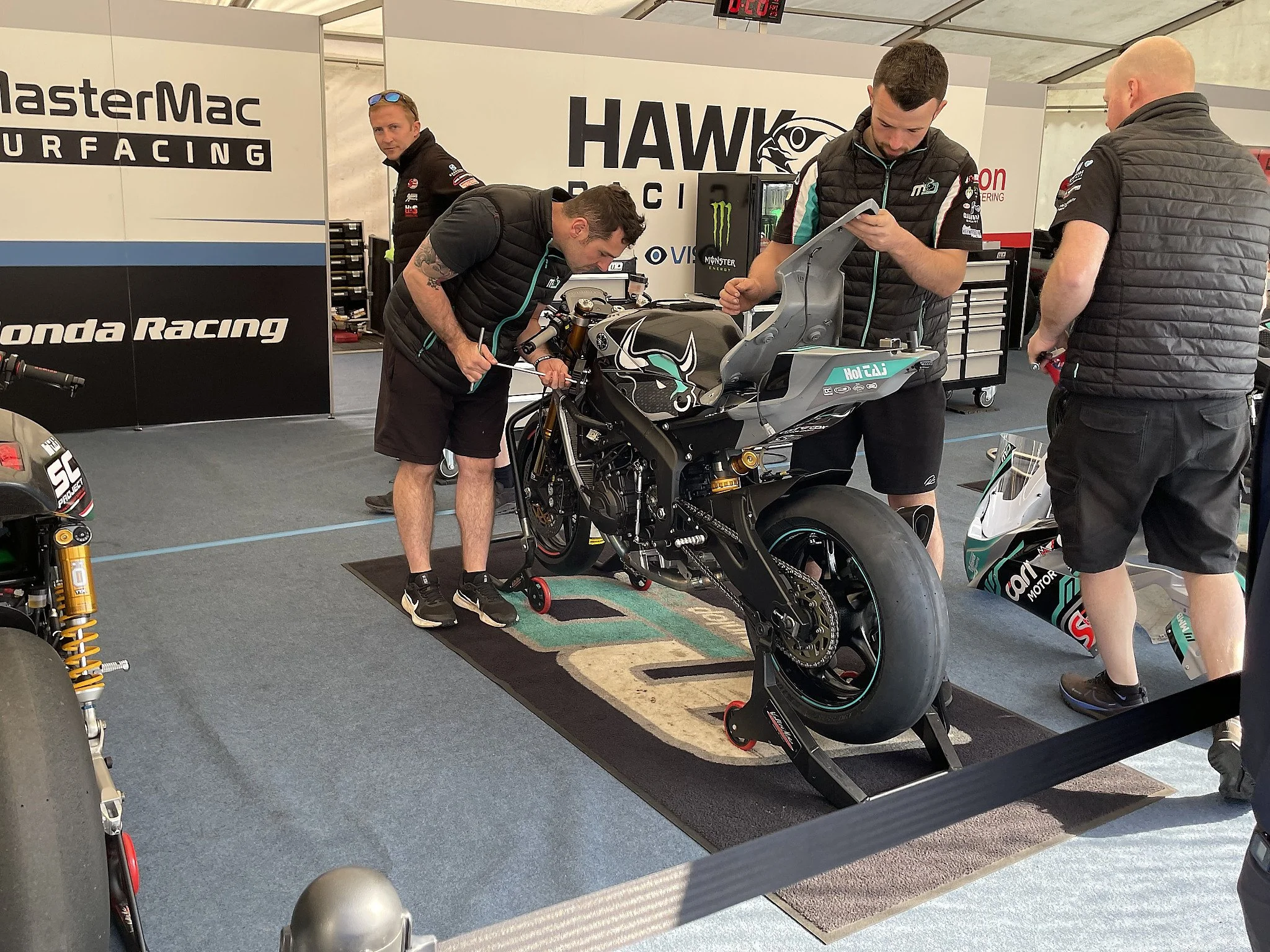Michael Dunlop (center), works on his MD Racing Yamaha for the Monster Energy Supersport TT Race 1