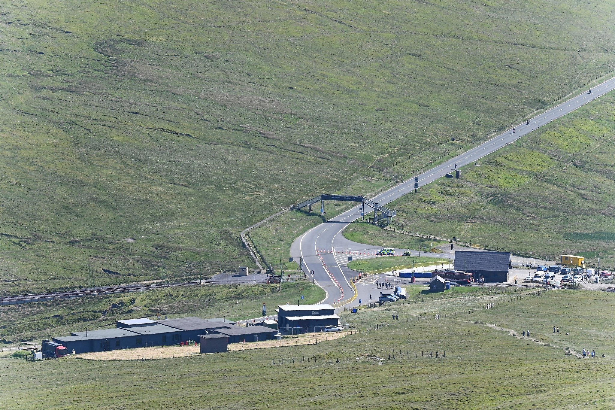A view of Bungalow - TT Course from the top of Mt Snaefell.  The Victory Cafe is on the lower left and the 1st Tram Stop is the building on the right. One historical note - what is now Victory Cafe was originally a Cold War Radar Installation.