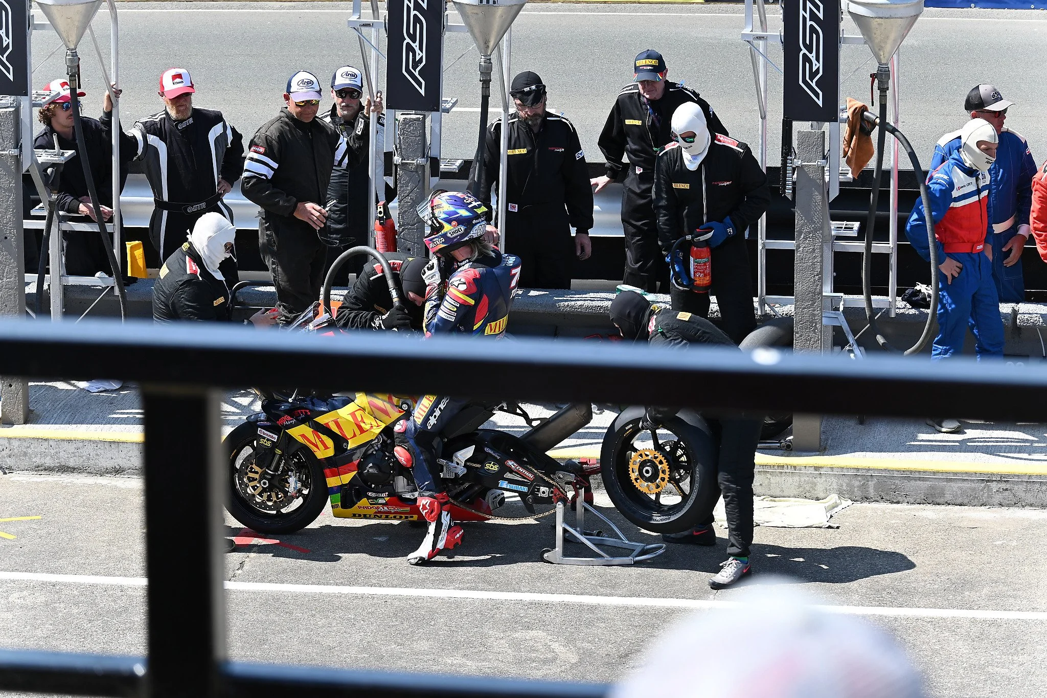 #8 Davey Todd - 1000 Honda - Milencio by Padgetts Motorcycle racing takes on gas and a new rear tire. Photo taken from the Grandstands on Glencrutchery Road.