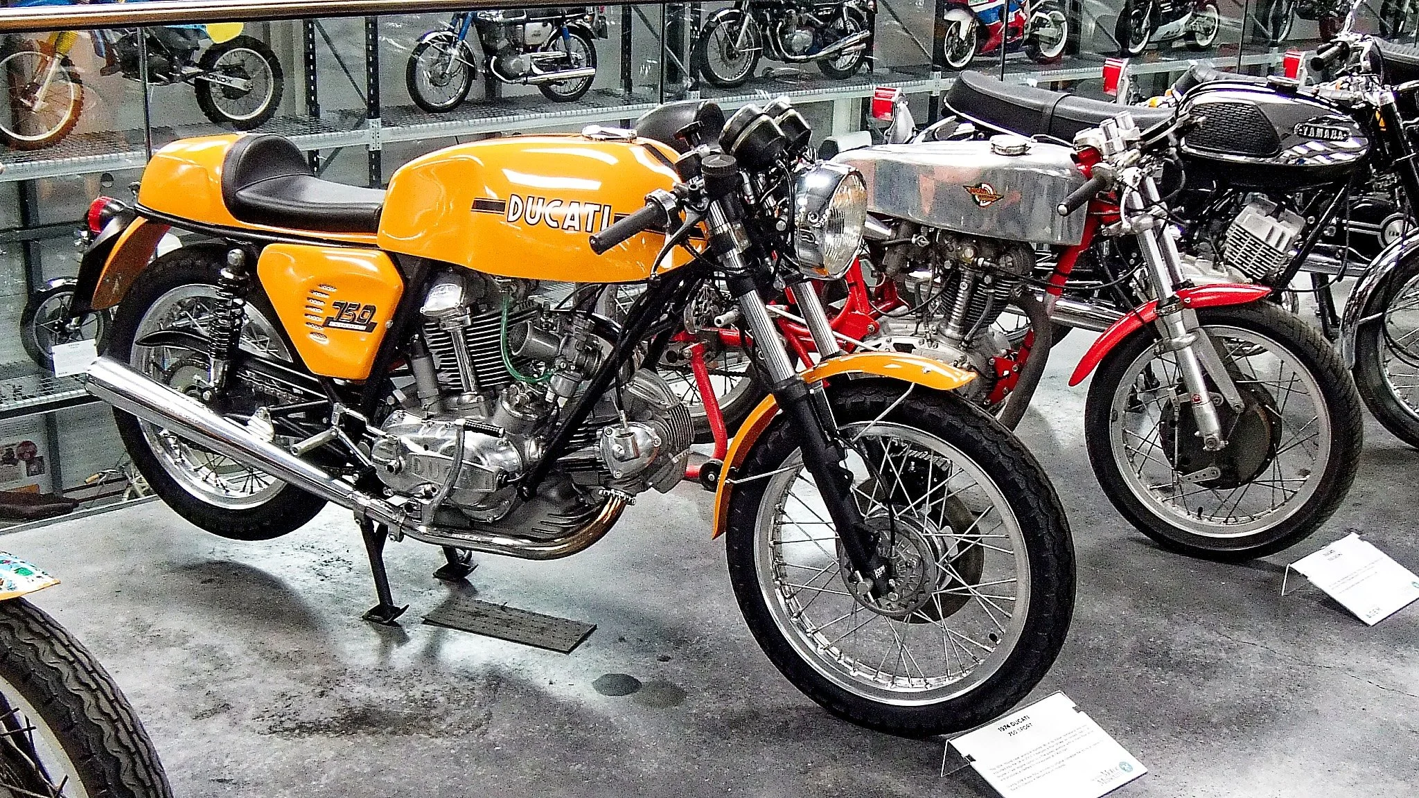 A 1974 Ducati 750 in a color you don't often see one in. The Ducati with the silver tank is a 125cc 4-stroke from 1956-58 era.