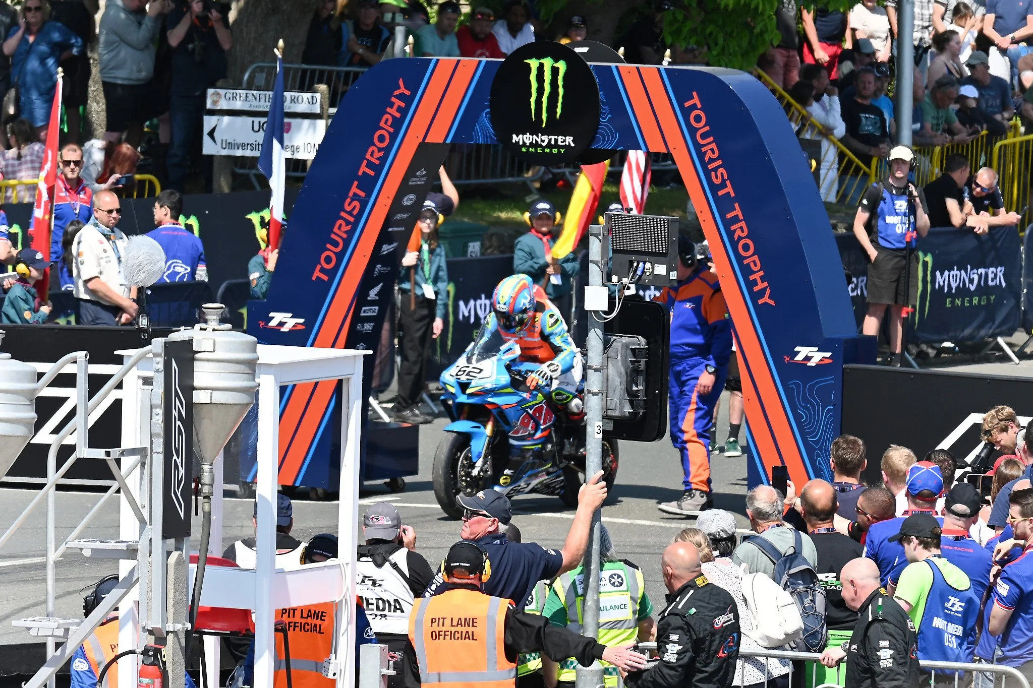 #62 Ryan Cringle - 1000 Honda - AGR Motorsports racing has just received his tap on the shoulder and is starting off on his first lap of the RST Superbike TT race. Photo taken from the Grandstands on Glencrutchery Road.