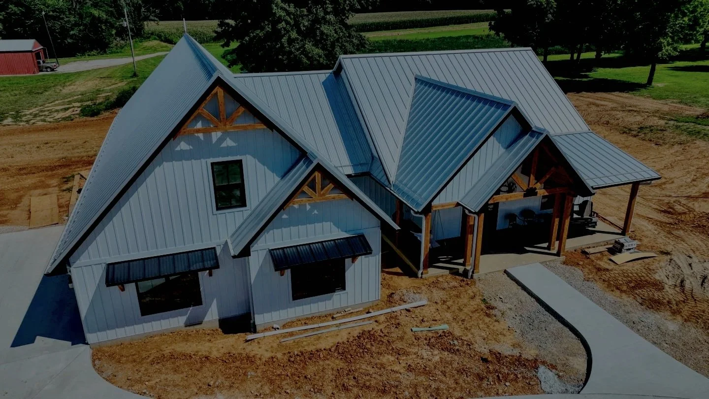Standing seam metal roof installation on a residential property in the Houston area
