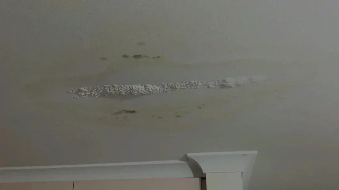 Interior ceiling damage caused by a roof leak after a storm in Houston
