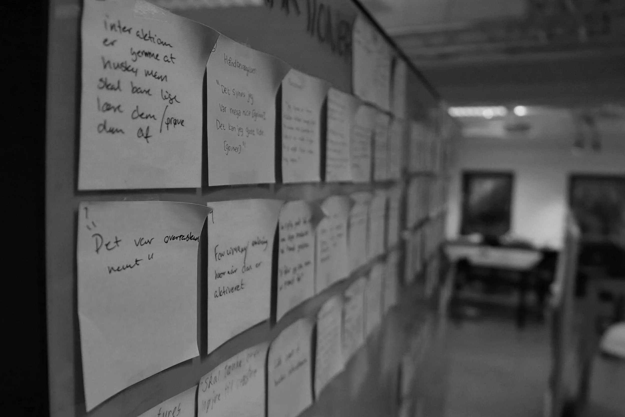 Sticky notes documenting team knowledge and workflows during an operations transformation initiative.