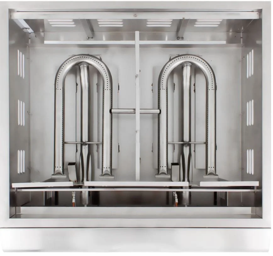 Interior of a stainless steel industrial oven or furnace with two arched heating chambers and control panels.