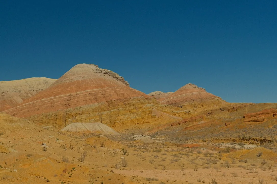 Striped red and white sandstone peaks of the Aktau Mountains in Altyn-Emel National Park, Kazakhstan