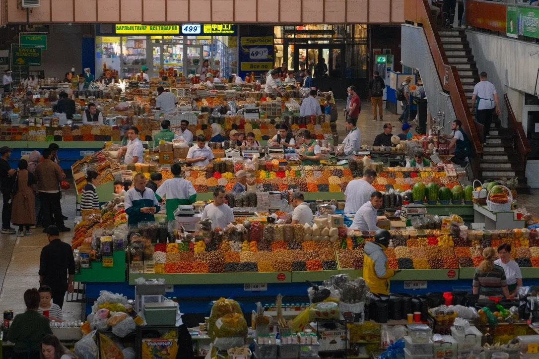 Overhead view of colorful fruit, nut and spice stalls at Green Bazaar (Zelyony Bazaar), Almaty, Kazakhstan