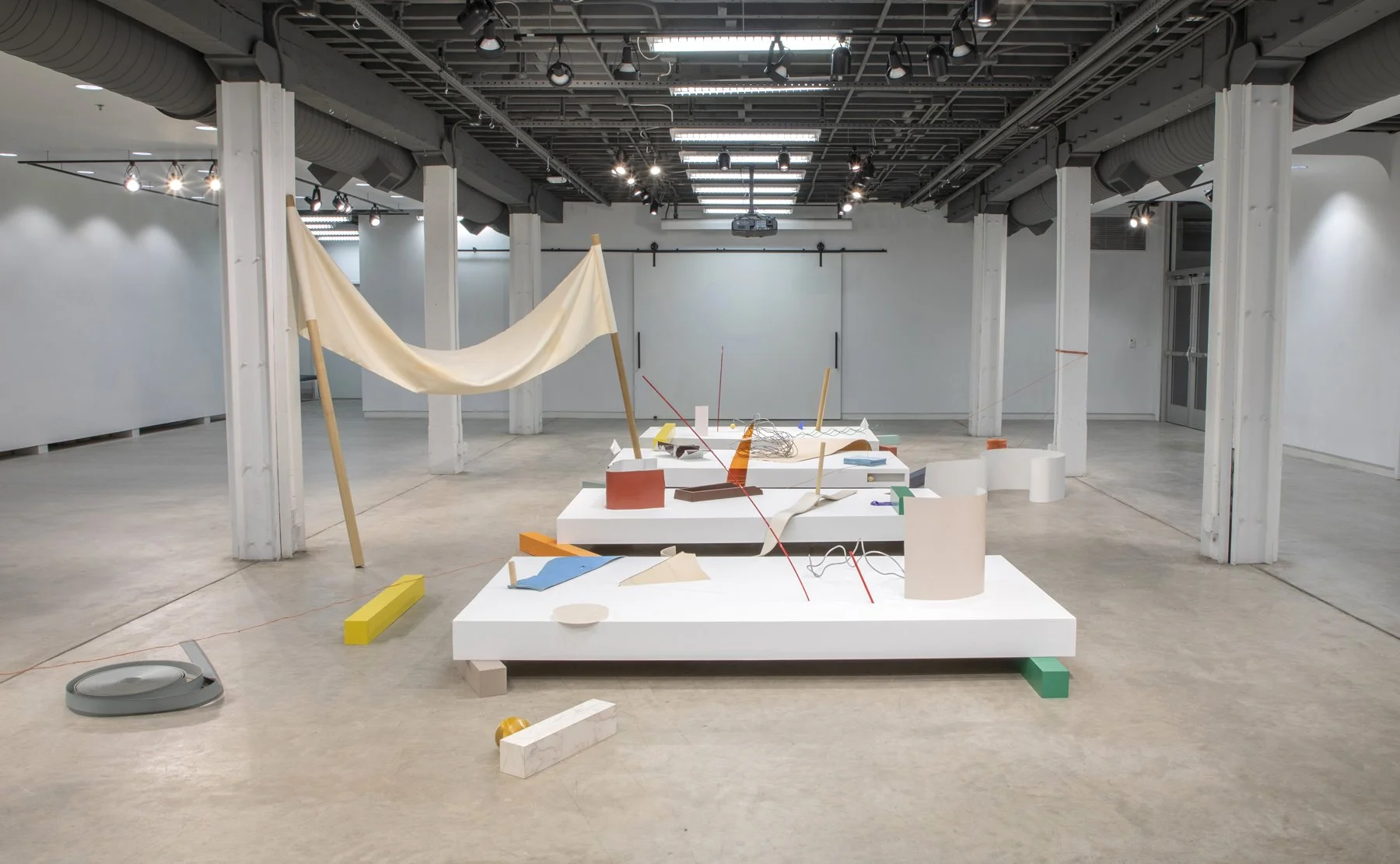 'False Stage' Dimensions Variable, Wood, acrylic, canvas, rubber, laminate veneer, plexiglass, aluminum, found books, leather, postcard, glass, rope, and cue balls. 2022