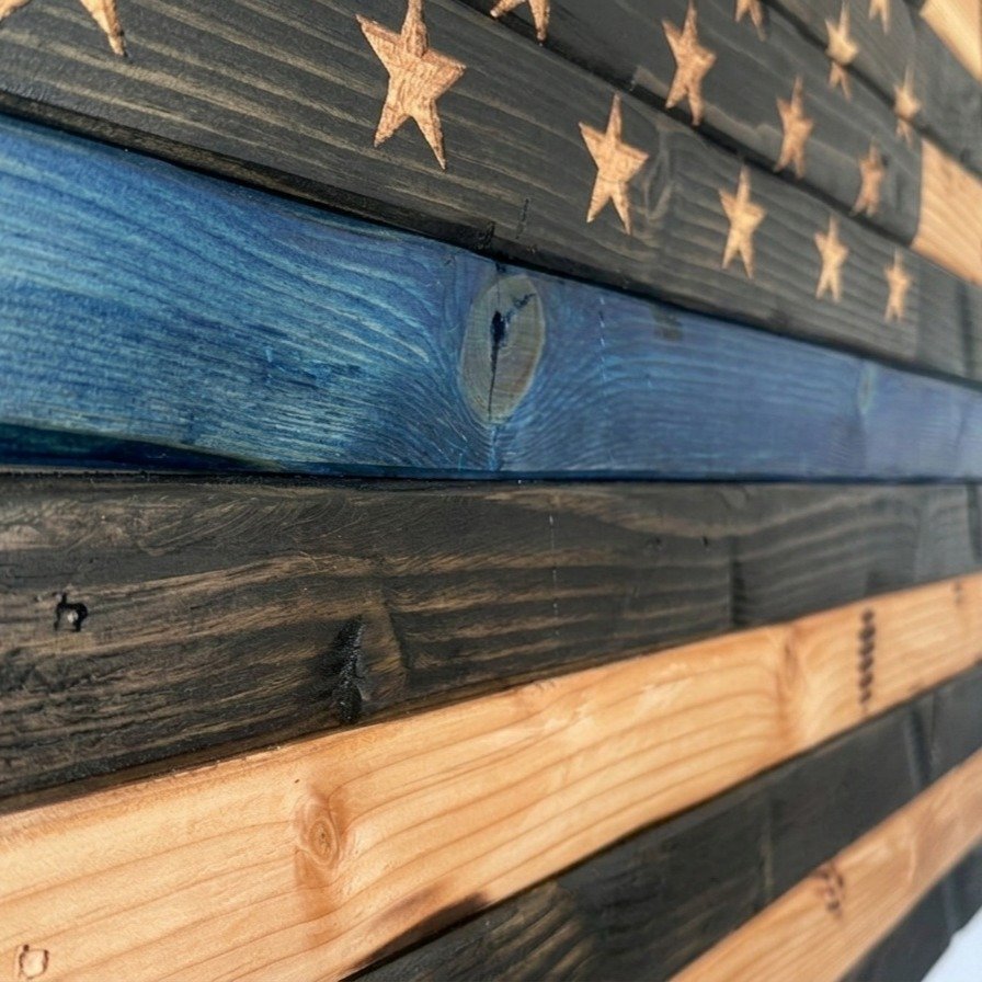 Honor. Courage. Sacrifice.

Crafted one board at a time, our Thin Blue Line wooden American flag is a tribute to the men and women who put on the badge and serve their communities every day.

Real wood. Timeless craftsmanship. Built with purpose.

He