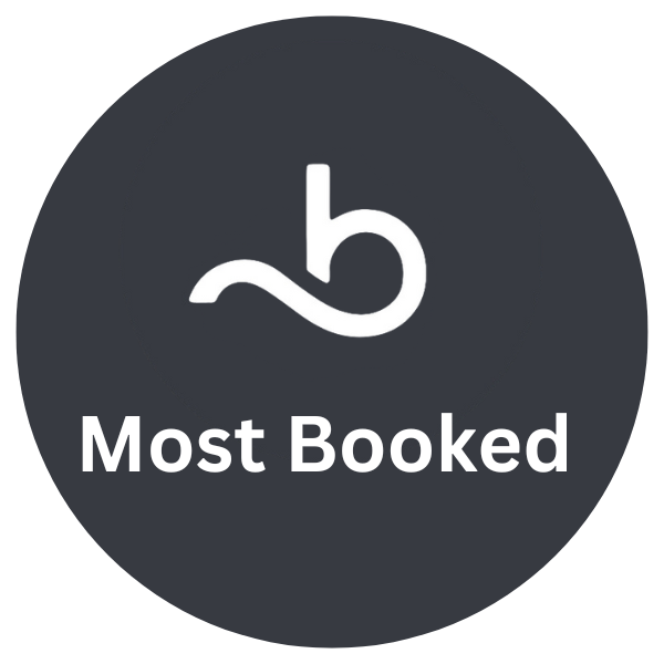 A dark circular badge with a white stylized 'b' logo at the top, followed by the text 'Most Booked' in white.
