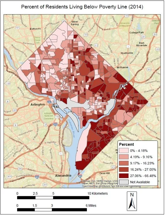 Map showing the percentage of residents living below the poverty line in Arlington, Alexandria, and surrounding areas in 2014. Darker red indicates higher poverty rates, with the highest areas along the river and southeastern parts.