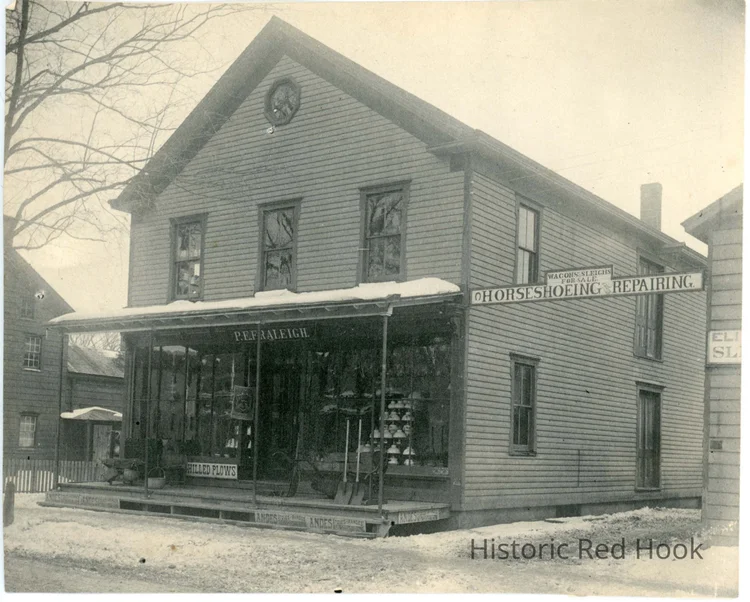 P. E. Fraleigh's hardware store, with HORSESHOEING painted on the side wall