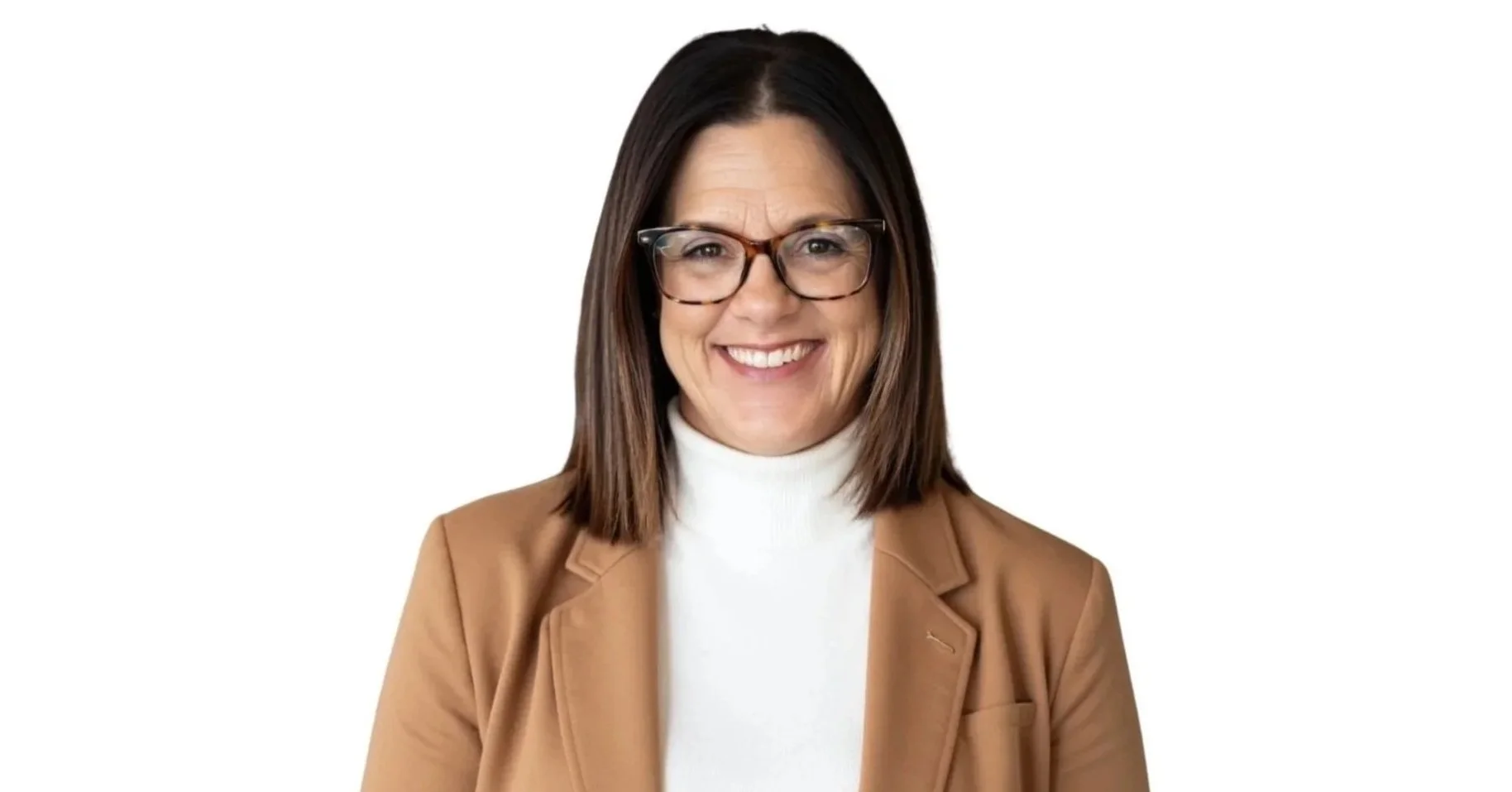 A woman with shoulder-length brown hair wearing glasses, a white turtleneck, and a tan blazer, smiling against a white background.
