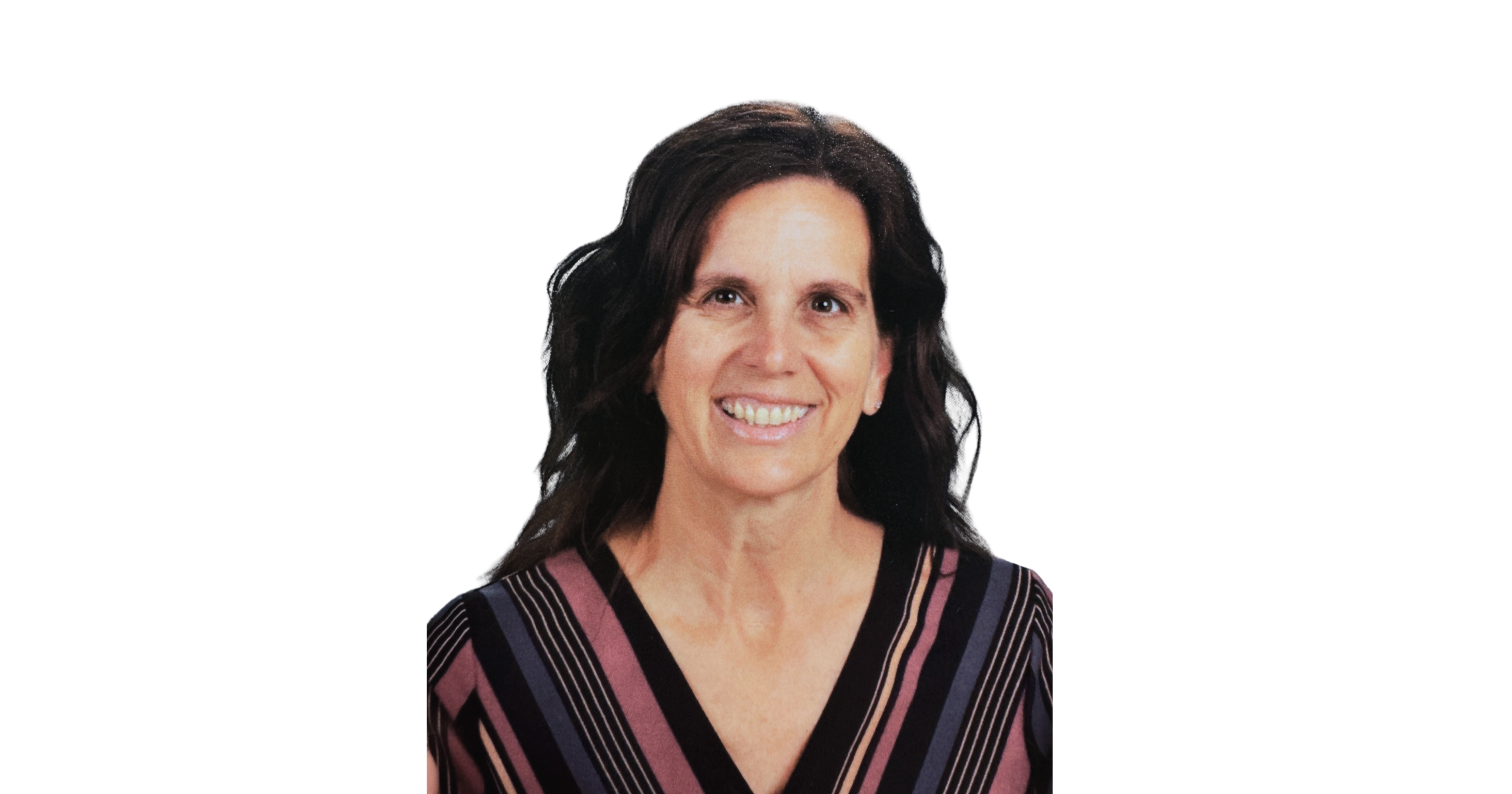 A woman smiling with dark, wavy hair, wearing a V-neck top with purple, black, pink, and white geometric stripes, against a plain white background.