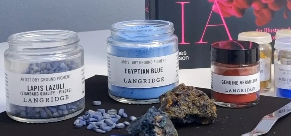 Lapis lazuli, Egyptian blue and genuine vermilion artist pigments in a working studio, illustrating the continuity of historical materials in contemporary artistic practice.
