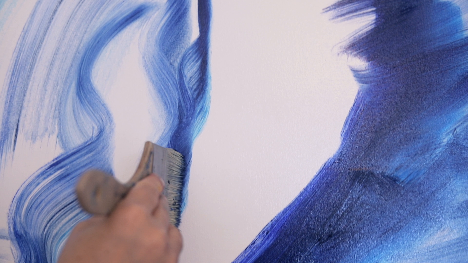 Close-up of an early paint layer being applied to an oil painting by Veronika Kyrychenko.