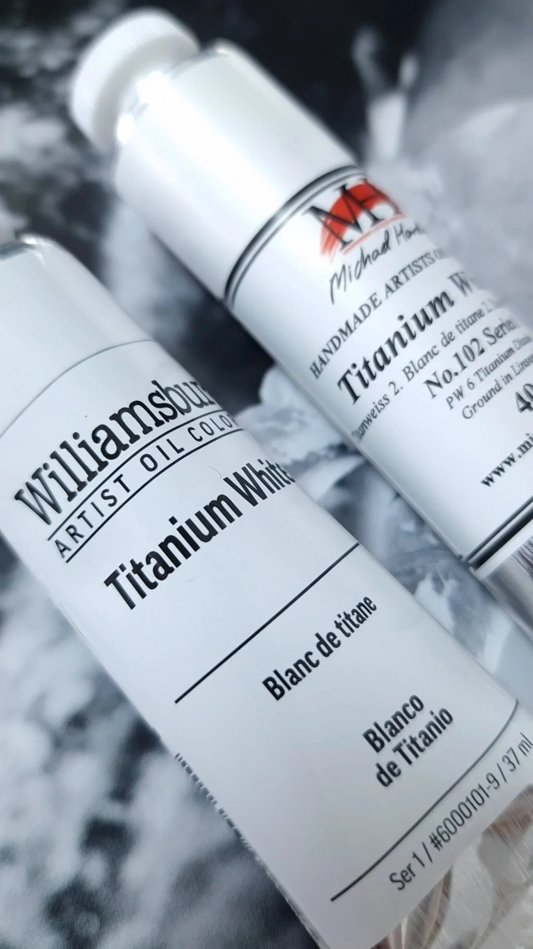 Williamsburg and Michael Harding professional Titanium White oil paints shown side by side.