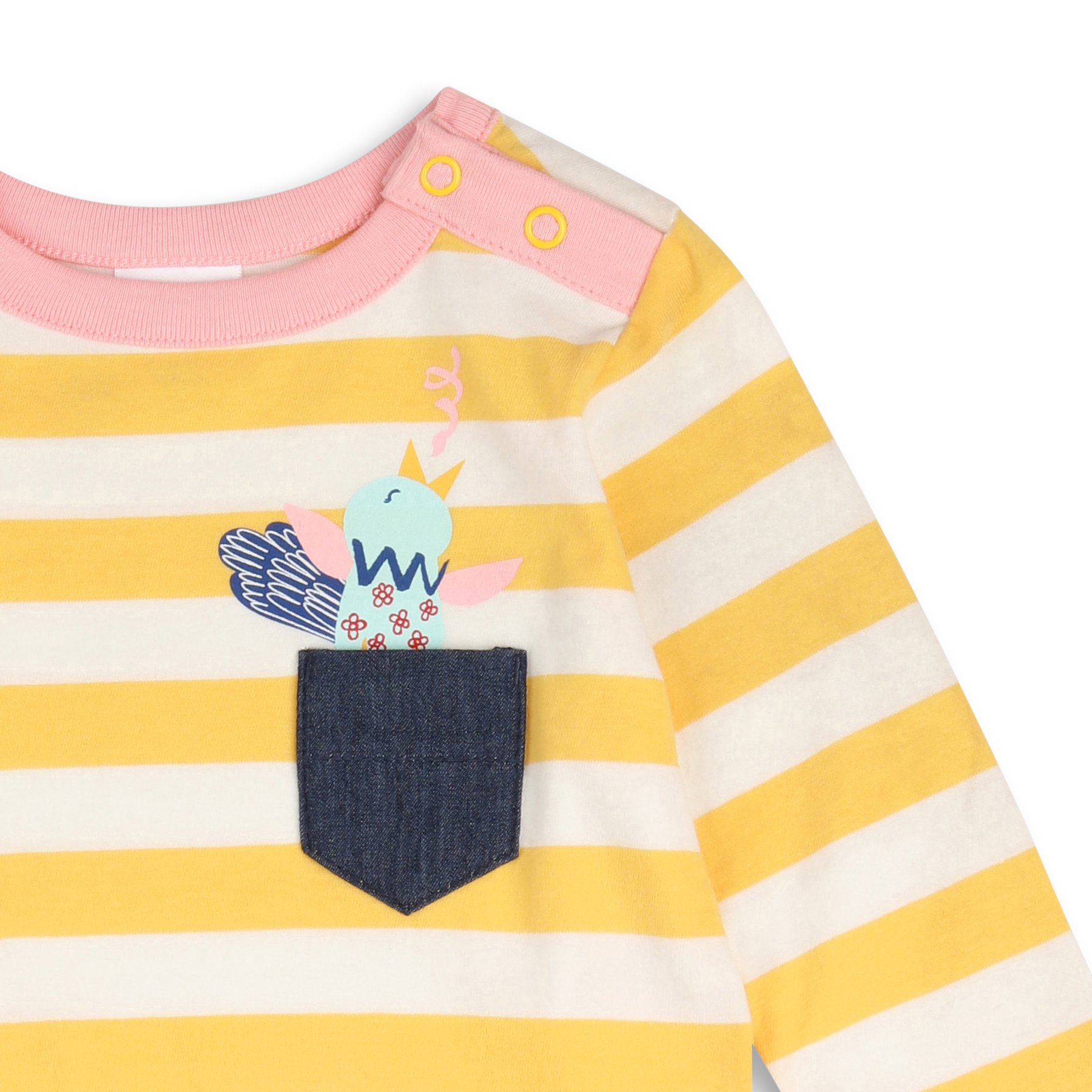 Close-up of a pink-collared yellow and white striped children's shirt with a unicorn graphic on the front, dark blue denim pocket, and yellow snap buttons on the shoulder.