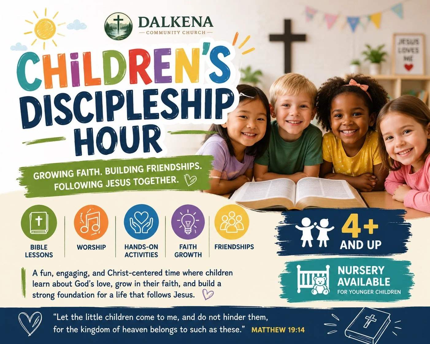 Children smiling at a table with an open Bible, in a church classroom setting. Banners and decorations are visible in the background.