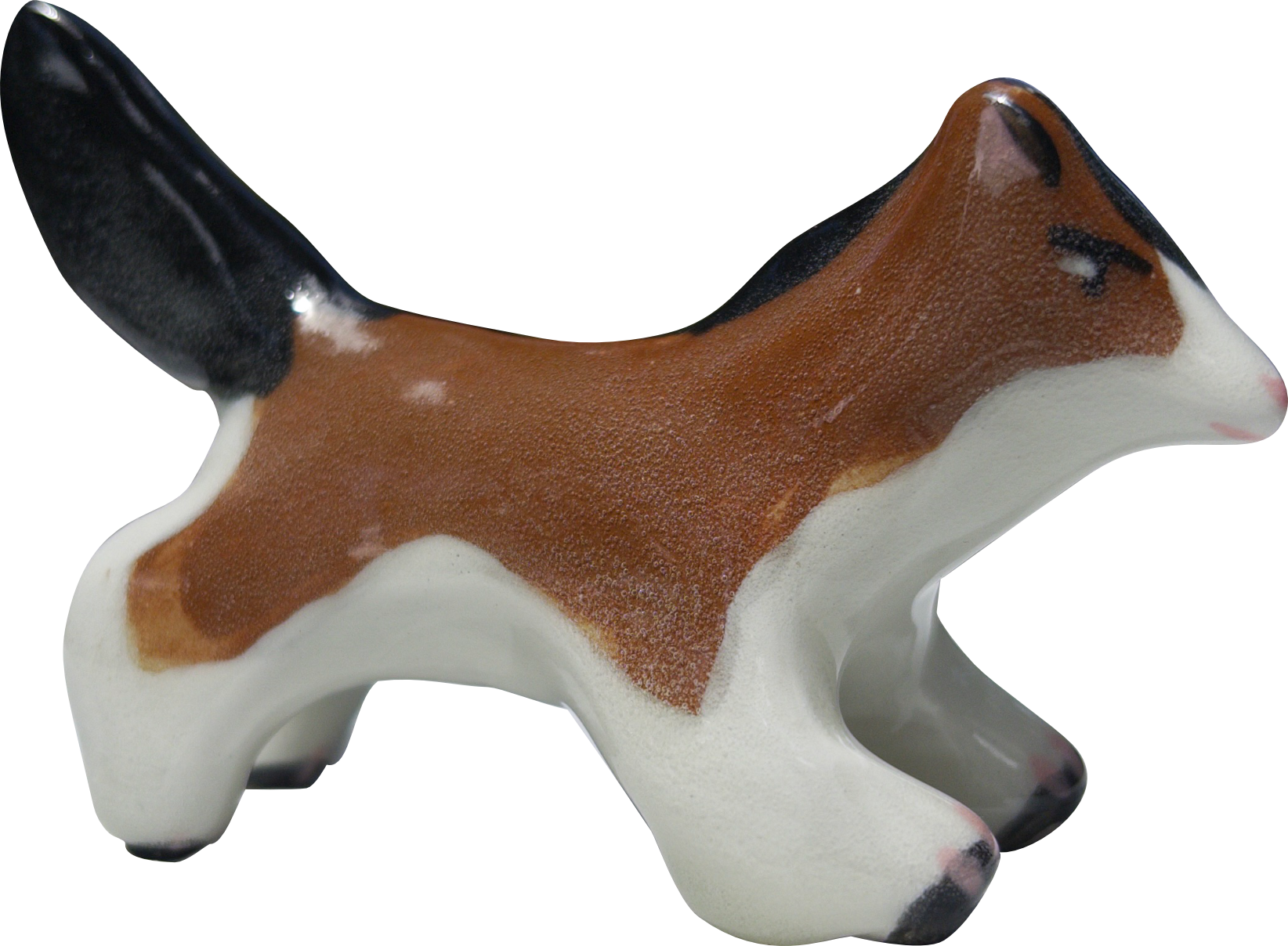 Ceramic figurine of a horse dog hybrid with black, brown, and white markings.