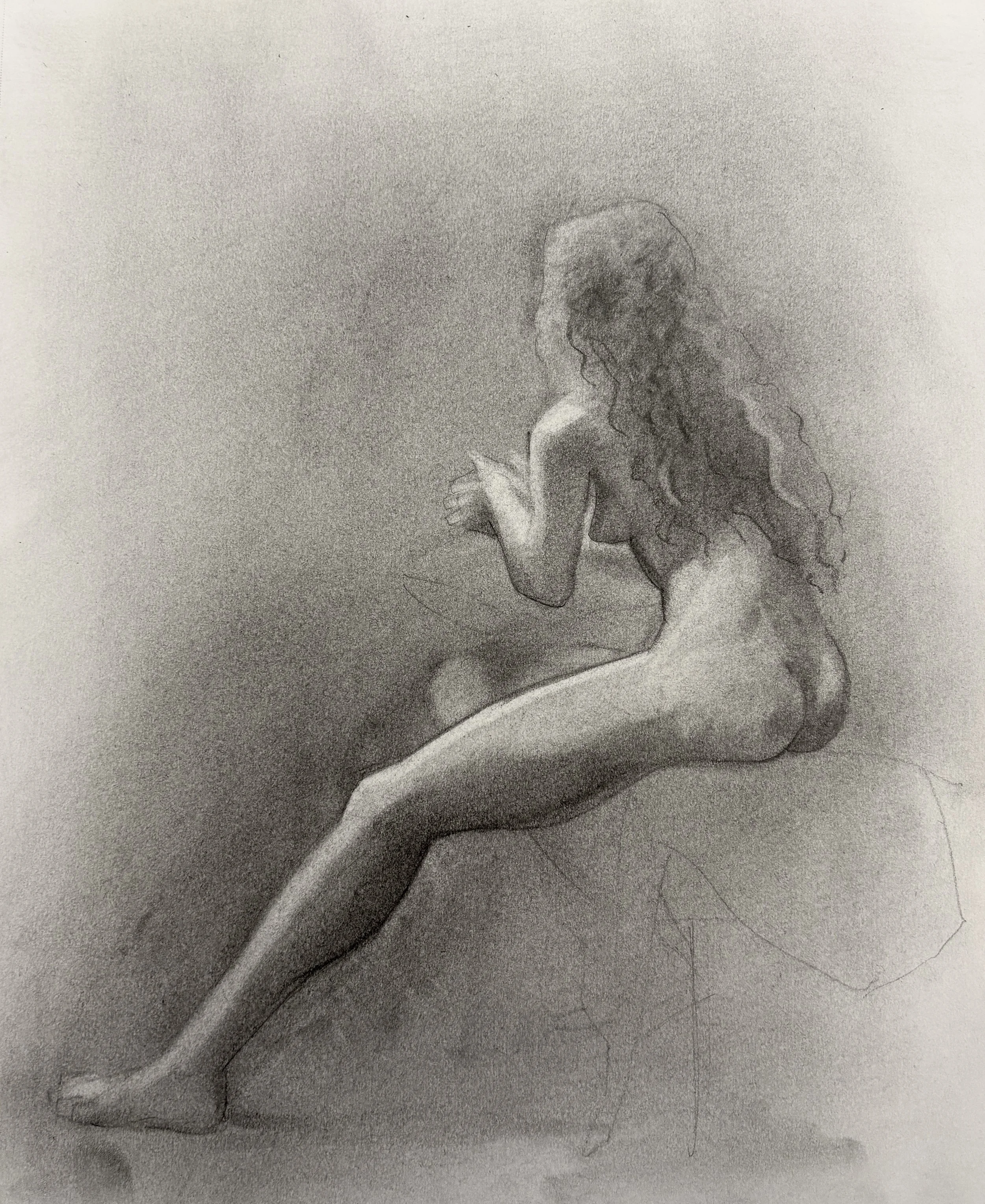 A detailed pencil drawing of a woman with long curly hair, viewed in profile, with one leg extended, the other bent away from the viewer.