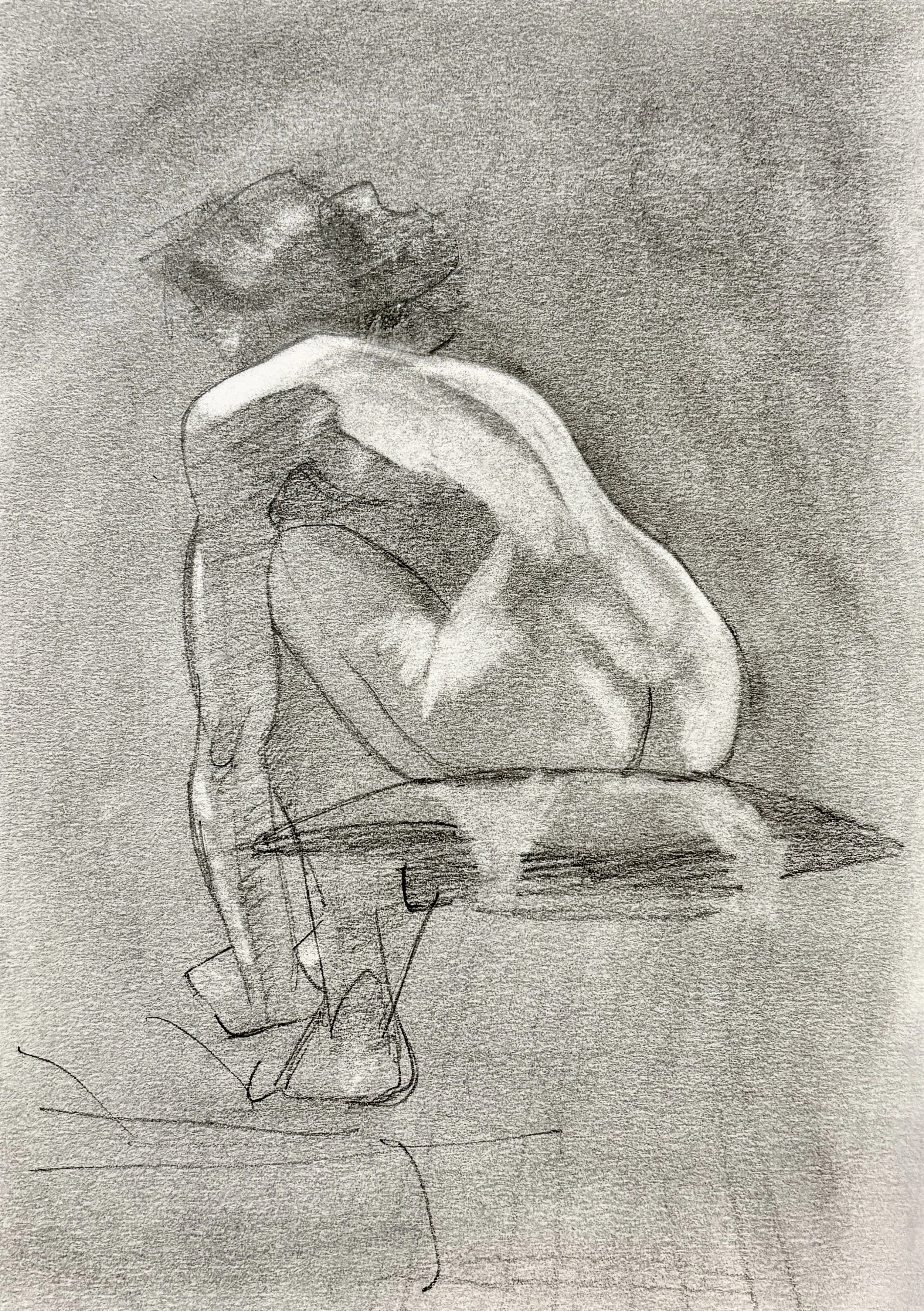 A detailed pencil sketch of a seated female nude leaning over her legs, face in profile.