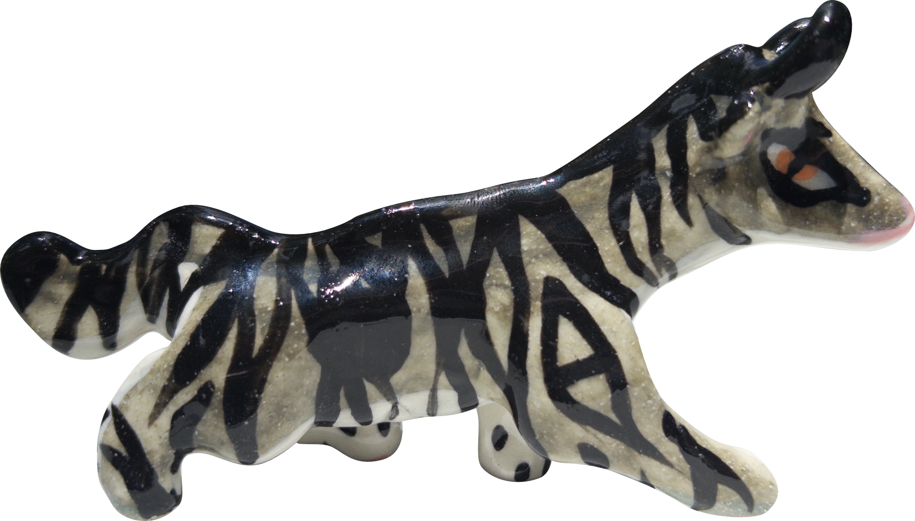 A ceramic cowcat figurine with black and grey striped pattern.