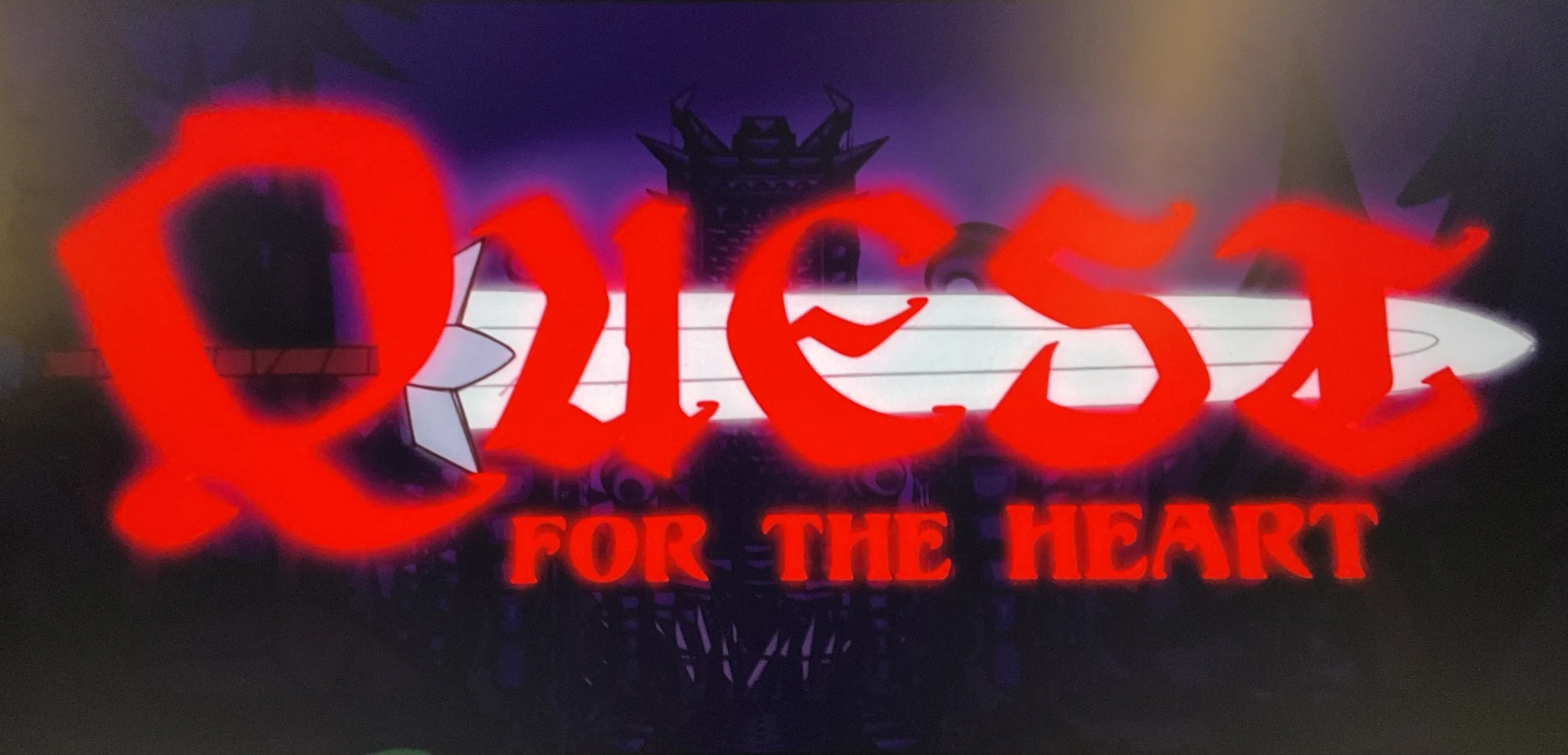 A neon sign with red and white colors displaying the words "Vices for the Heart" against a dark background.