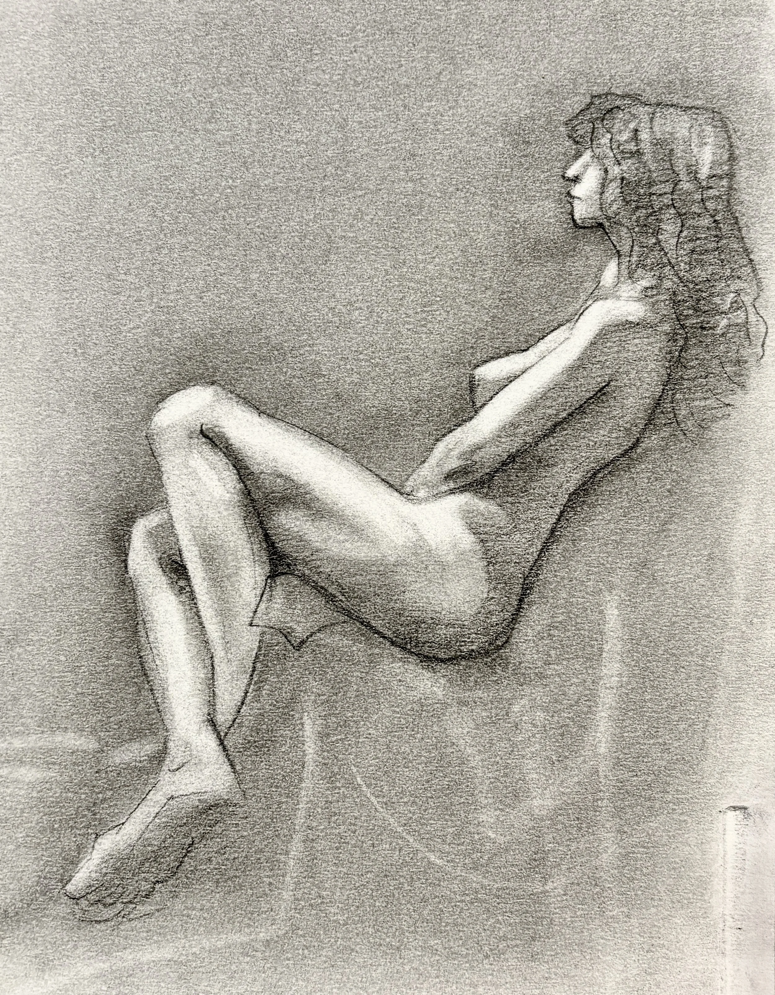 A detailed pencil sketch of a woman sitting with her arm resting across her middle, in profile view.