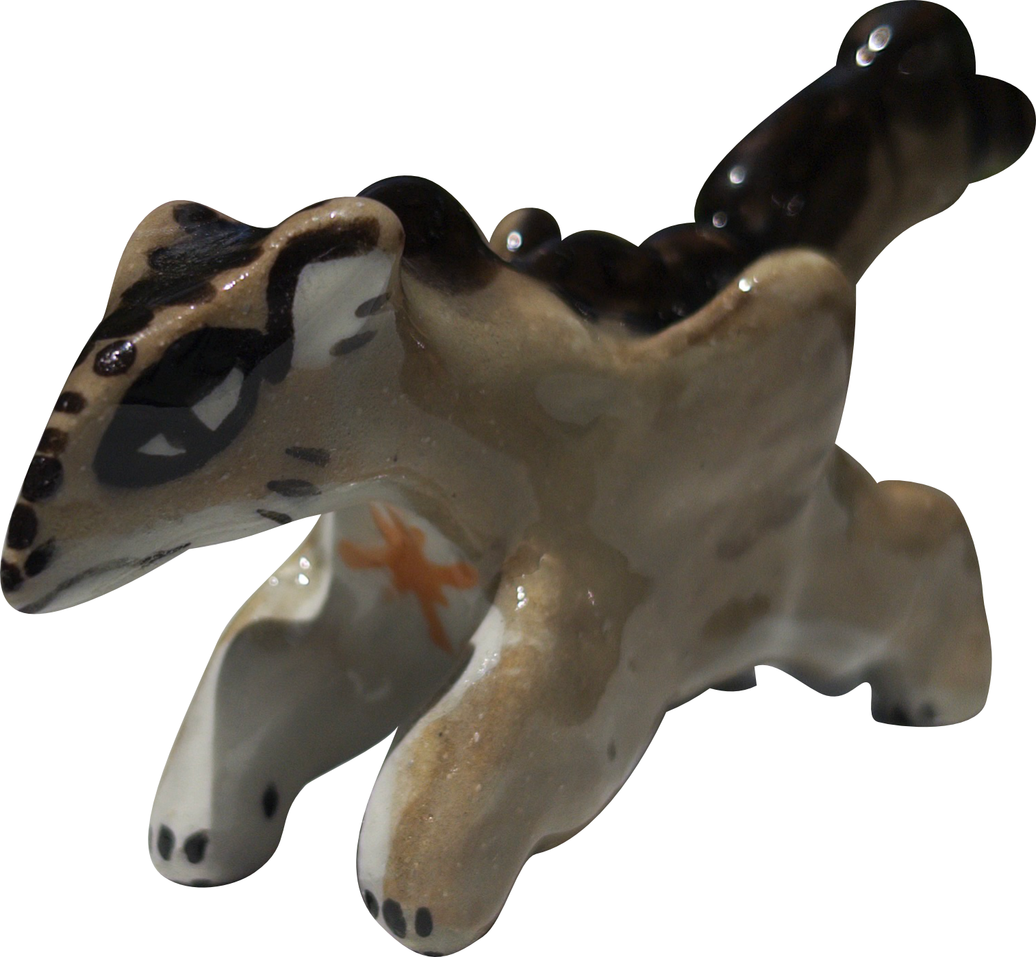 A ceramic pegasus dragon figurine with detailed painted markings and a glossy finish.