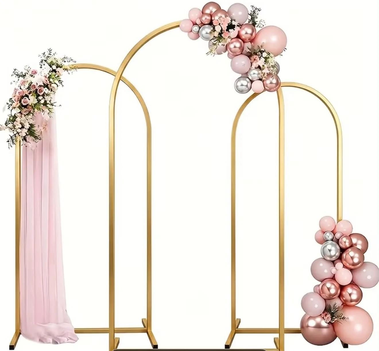 Decorative golden frame with pink and silver balloons and floral arrangements for a wedding or event backdrop.