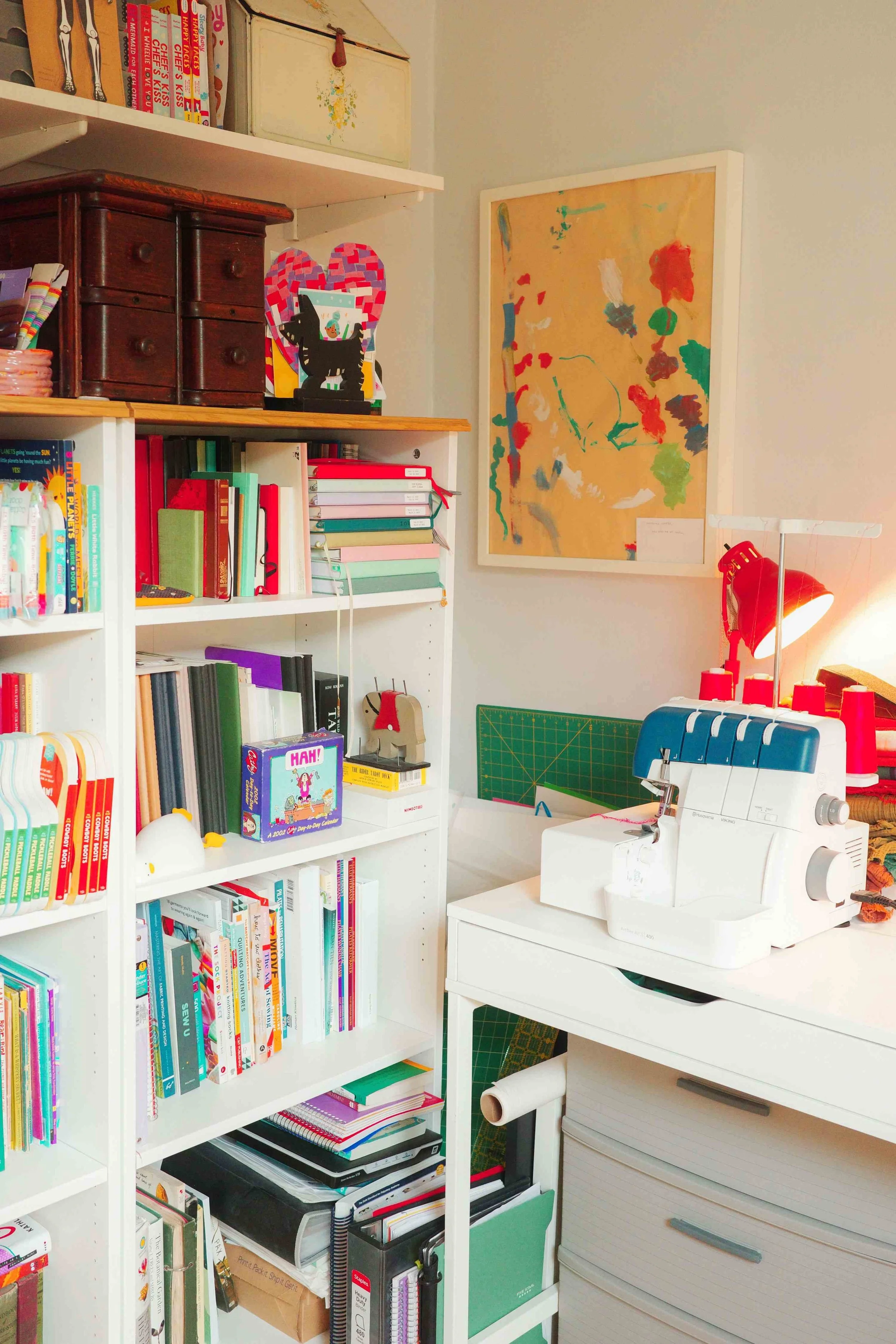 Denise Holmes’ illustration studio with a desk, bookshelves, artwork, and creative tools for making children’s books.