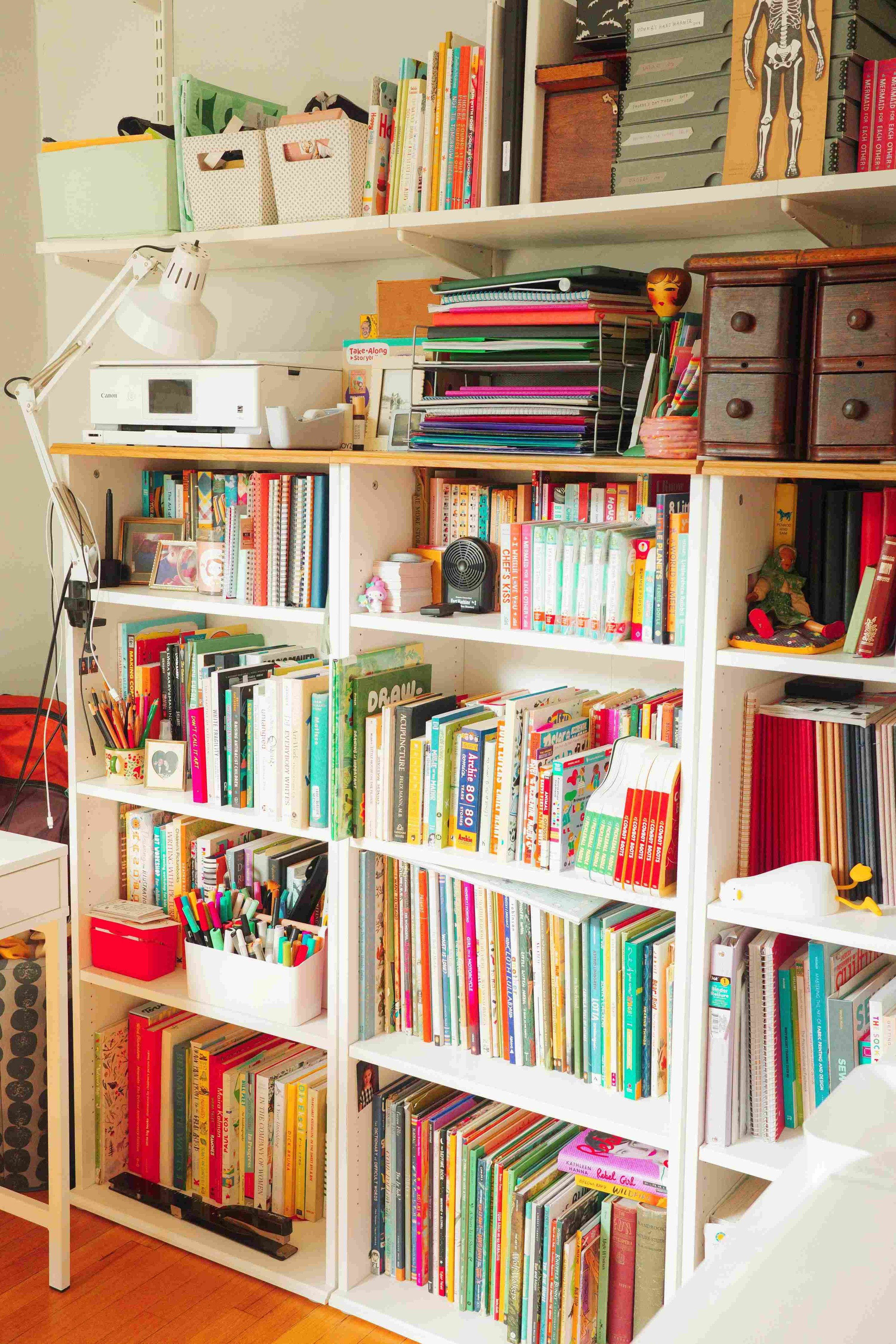 Denise Holmes’ illustration studio workspace with bookshelves, art supplies, and creative tools for making children’s books.