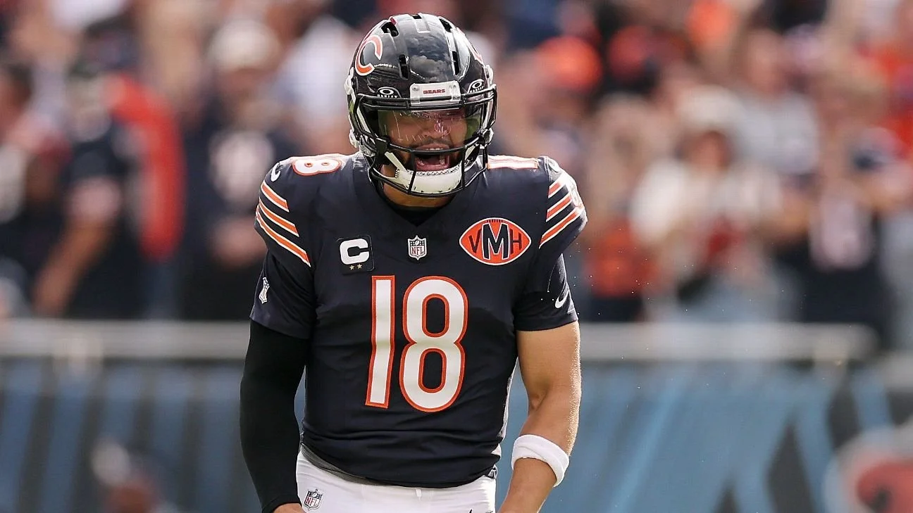 A football player in a black Chicago Bears uniform with the number 18, wearing a helmet, on the field during a game.