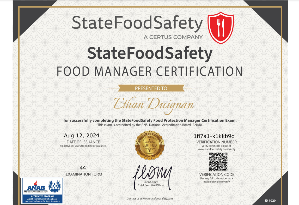Certificate of Food Manager Certification from StateFoodSafety awarded to Ethan Duignan, issued August 12, 2024, signed by John Comly, with StateFoodSafety logo and an accreditation badge.